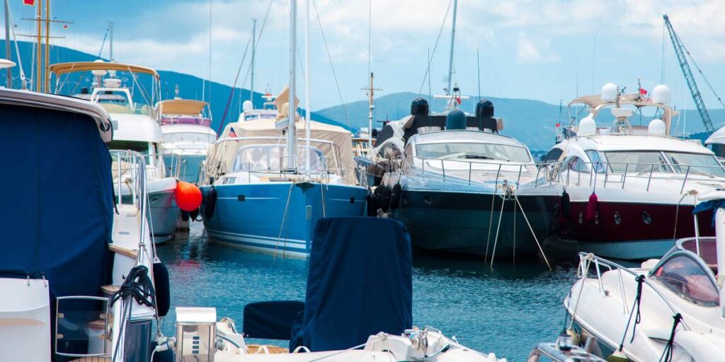 Multiple yachts are moored in a port for maintenance and repair