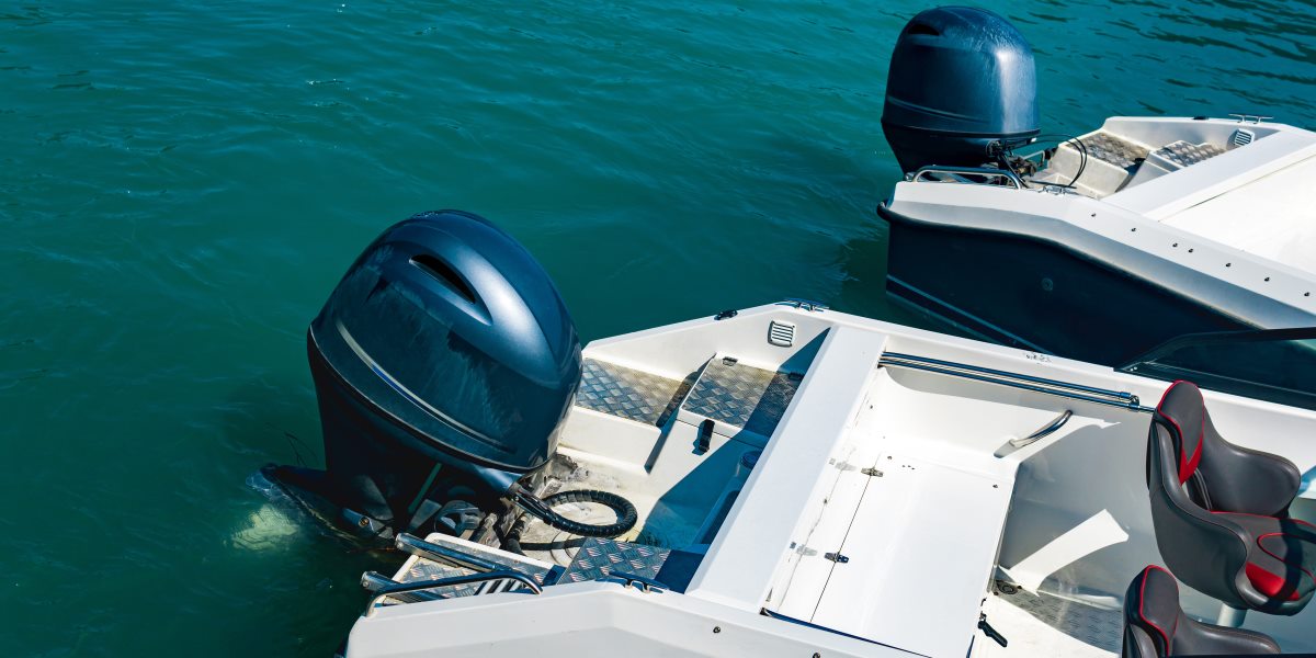 Two moored motorboats with outboard motors.