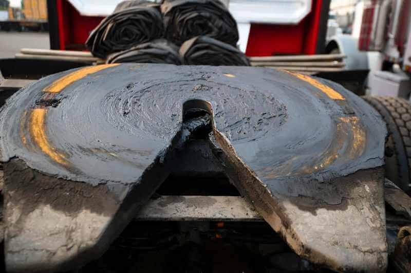 Greasing the Fifth Wheel on a Semi-Truck